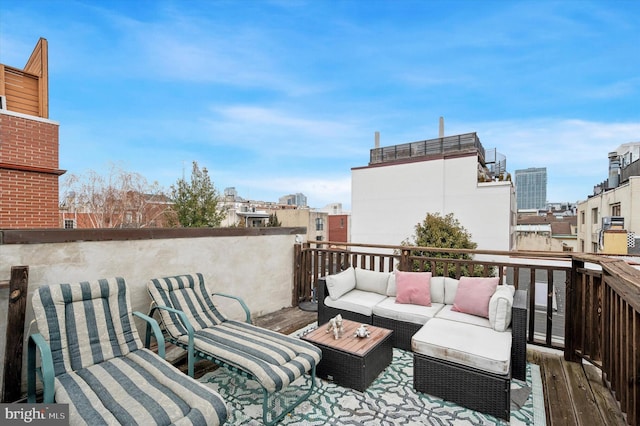 wooden deck featuring outdoor lounge area