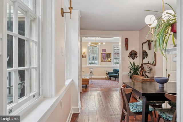 interior space with dark hardwood / wood-style flooring and a notable chandelier