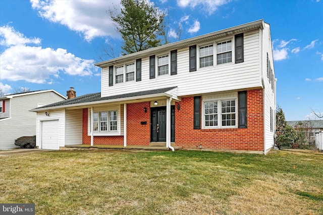 view of front of house featuring a garage and a front lawn