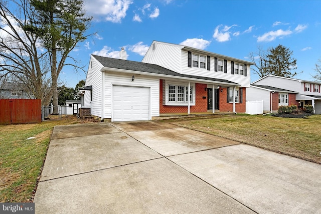 view of front property with a garage and a front yard