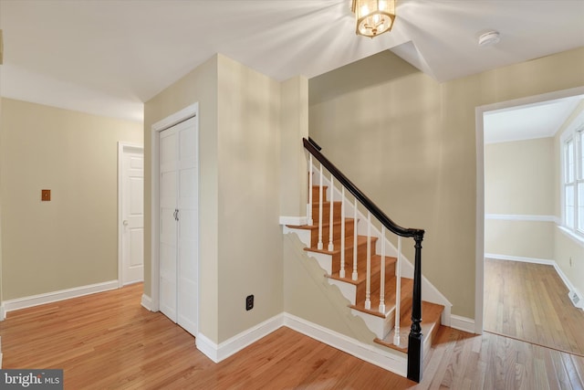 stairs with hardwood / wood-style flooring