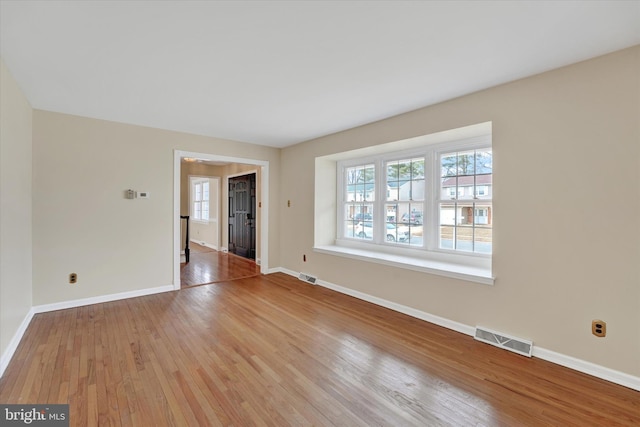 spare room featuring light hardwood / wood-style flooring