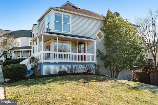 view of front of home featuring a front lawn and a porch