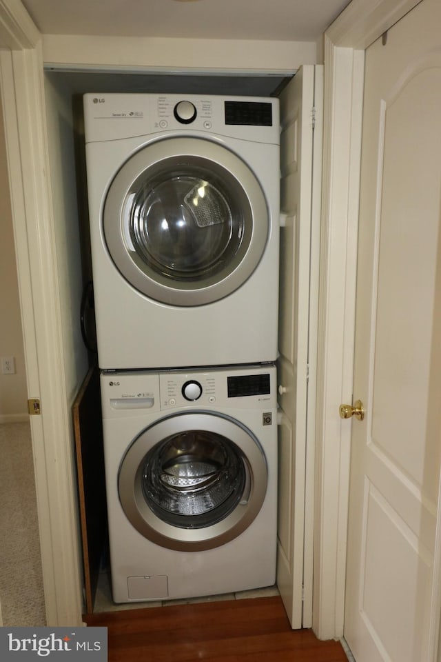 laundry room with stacked washer and dryer