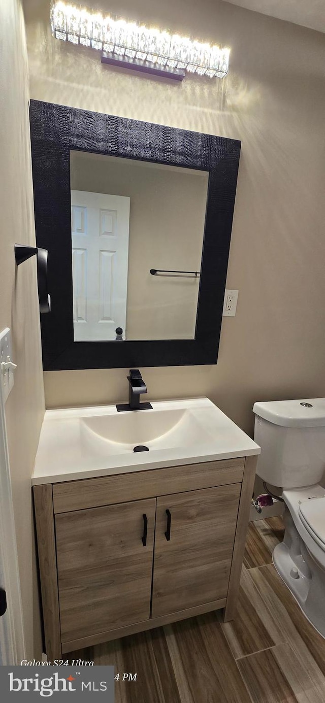 bathroom with vanity and toilet