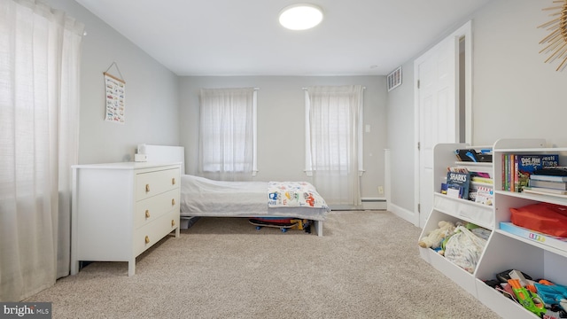 bedroom with light carpet