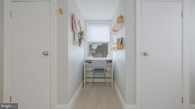 hall featuring baseboard heating