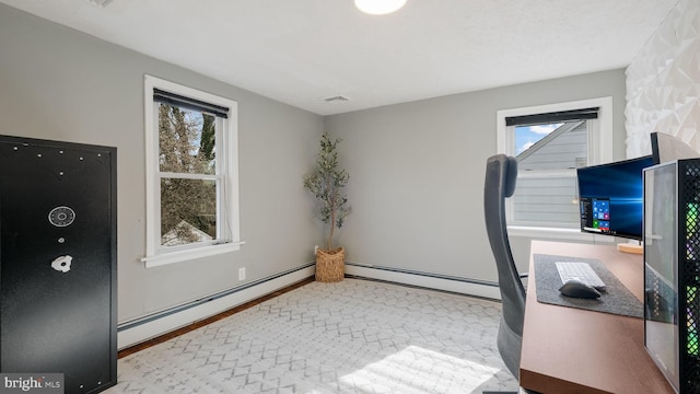 office area with a baseboard radiator and light hardwood / wood-style floors