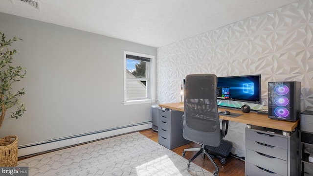 office space featuring a baseboard radiator and wood-type flooring