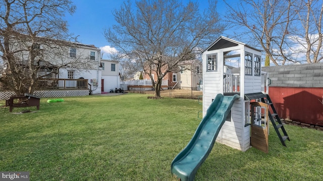 exterior space with a playground and a deck