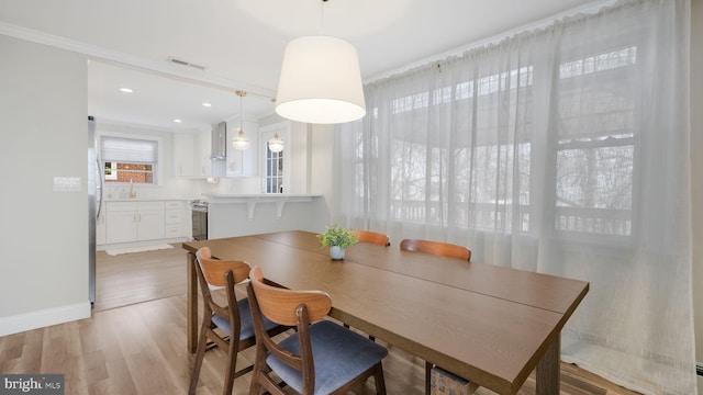 dining area with hardwood / wood-style floors