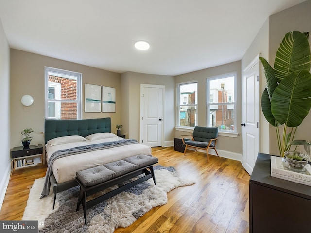 bedroom with light hardwood / wood-style flooring