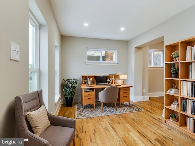 office with light hardwood / wood-style floors