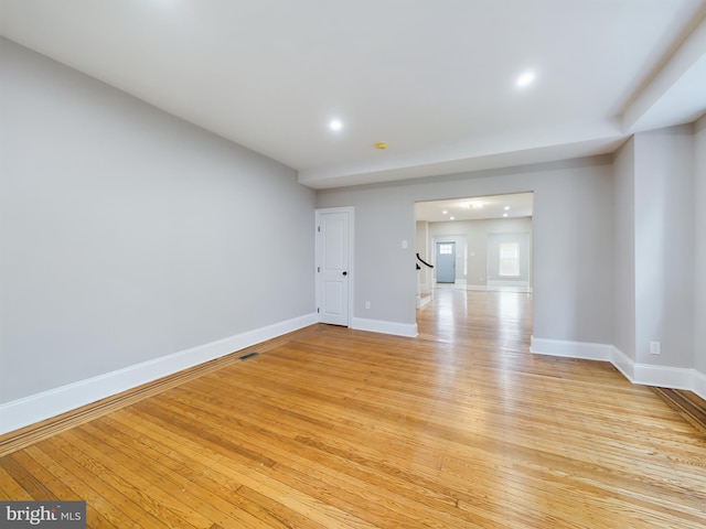 unfurnished room with light wood-type flooring