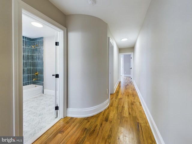 hallway featuring hardwood / wood-style floors