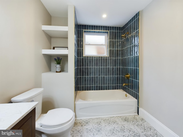 full bathroom featuring tile patterned flooring, vanity, toilet, and tiled shower / bath