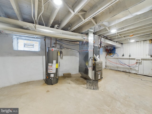 basement featuring gas water heater, heating unit, and electric panel