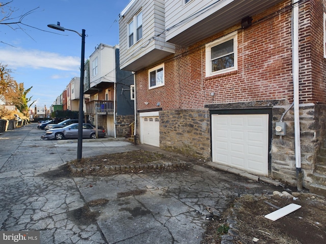 view of side of property featuring a garage