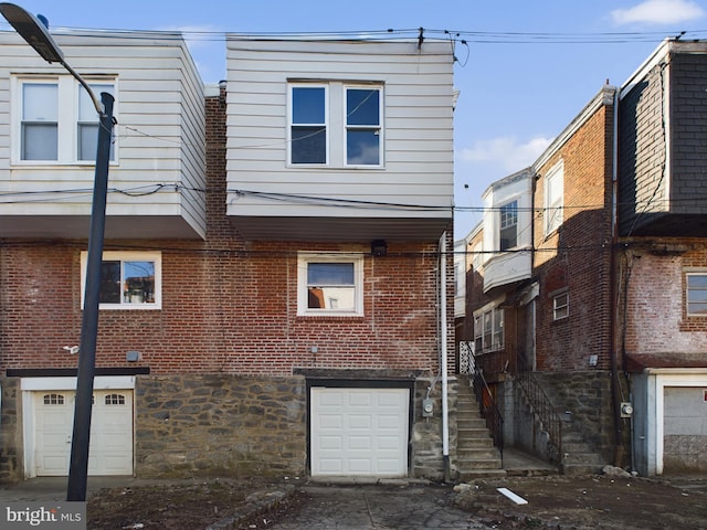 back of house with a garage