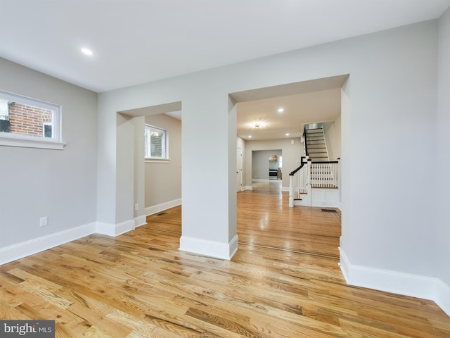 unfurnished room with light hardwood / wood-style flooring