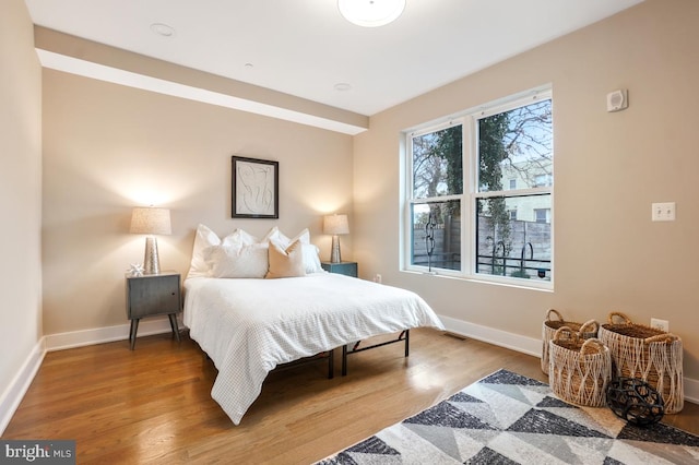 bedroom with wood-type flooring