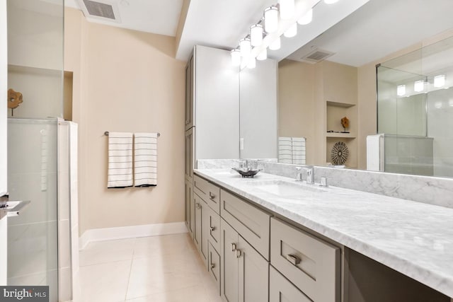 bathroom featuring vanity, built in shelves, tile patterned floors, and walk in shower