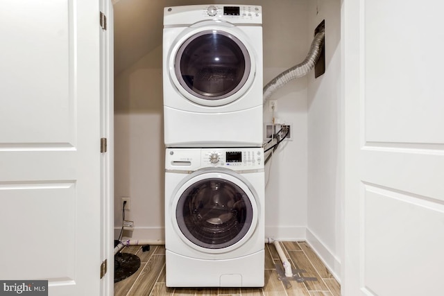 washroom with stacked washer and dryer