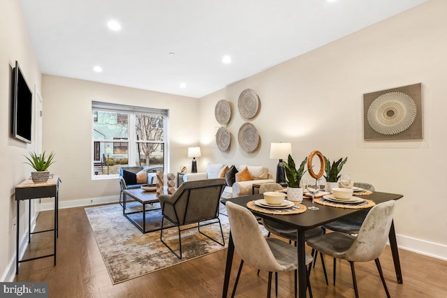 dining space featuring hardwood / wood-style floors