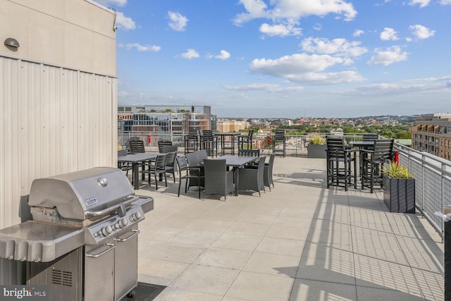 view of patio featuring area for grilling and exterior bar