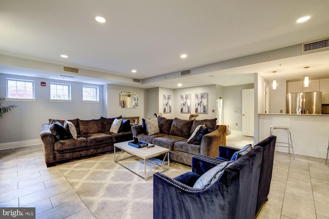 living room with light tile patterned floors