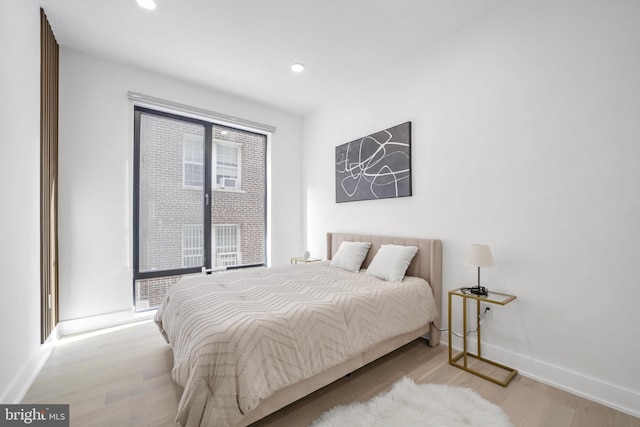 bedroom with light hardwood / wood-style floors