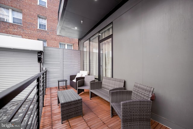 wooden terrace featuring an outdoor hangout area