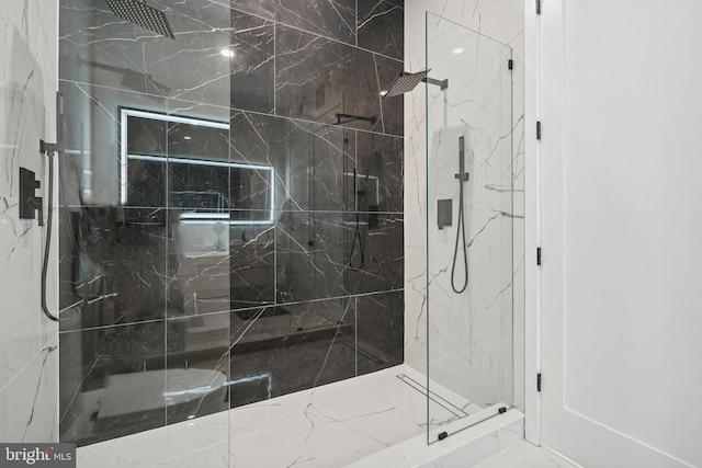 bathroom featuring a tile shower