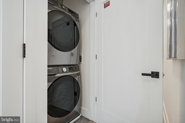 laundry room featuring stacked washing maching and dryer