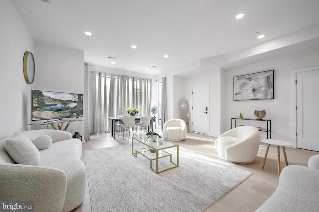 living room with light hardwood / wood-style floors