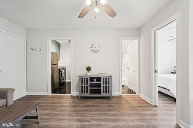 interior space with wood-type flooring and a textured ceiling