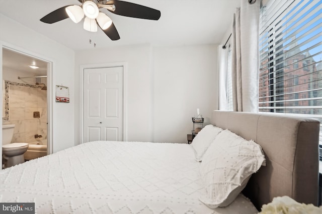 bedroom with ensuite bathroom and ceiling fan