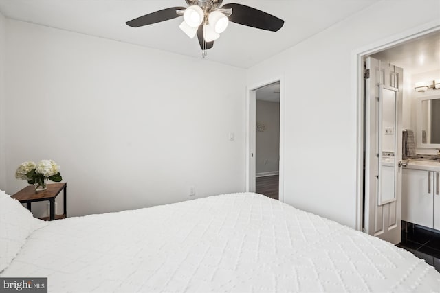 bedroom featuring connected bathroom and ceiling fan