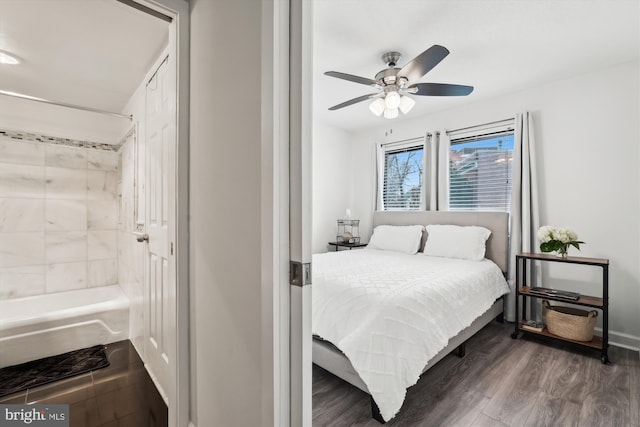 bedroom featuring dark hardwood / wood-style floors and ceiling fan