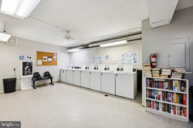 interior space featuring ceiling fan and independent washer and dryer