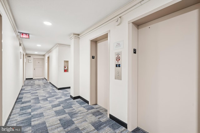 hall featuring elevator and dark carpet