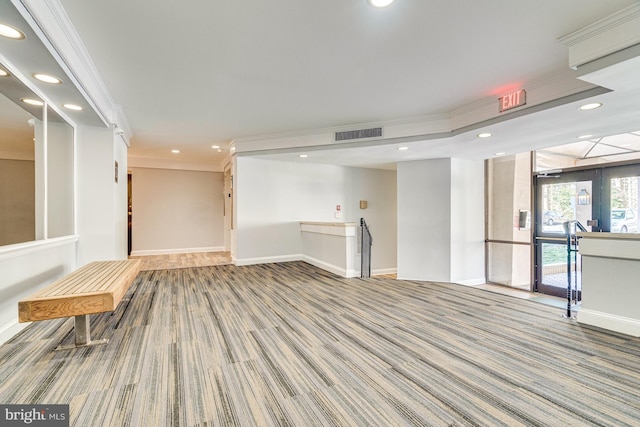 interior space with crown molding and carpet floors