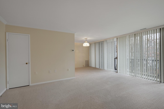 unfurnished room featuring light carpet