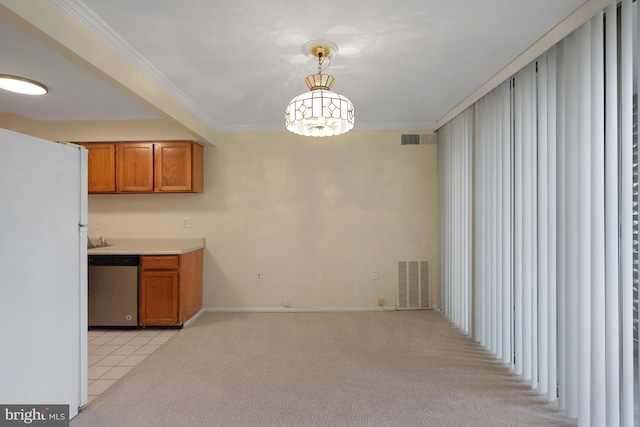 kitchen with pendant lighting, stainless steel dishwasher, light carpet, and white fridge