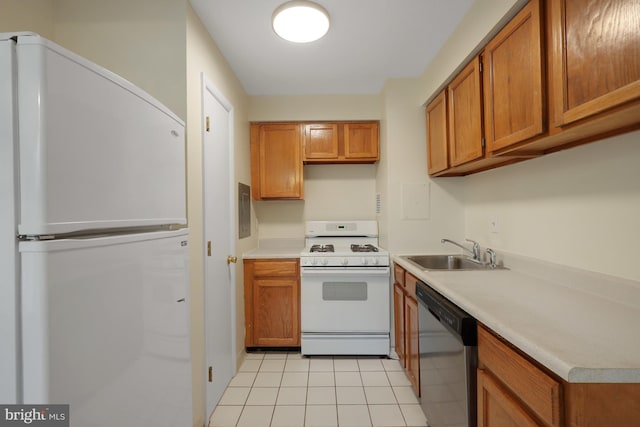 kitchen featuring sink, white appliances, and light tile patterned floors