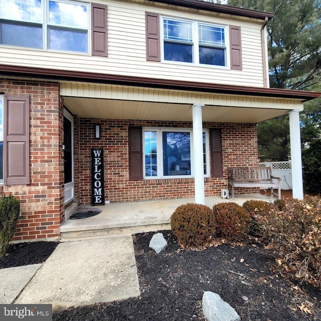 property entrance with covered porch