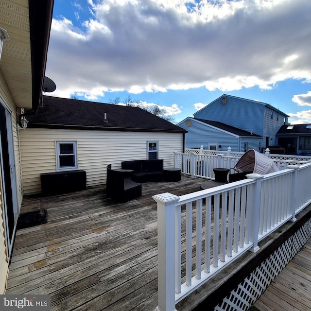 wooden deck with outdoor lounge area