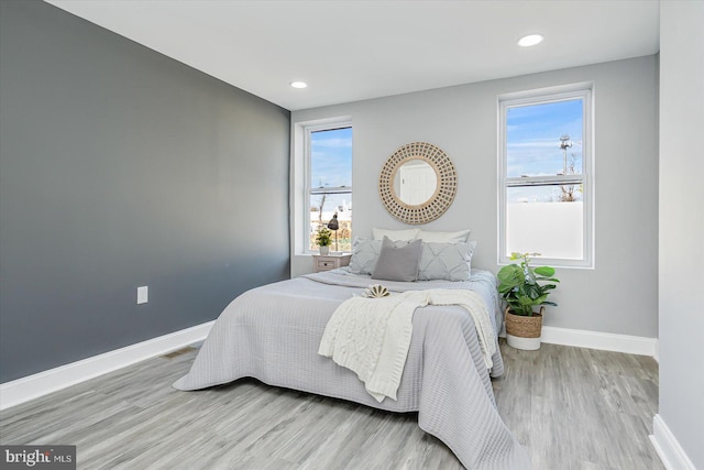 bedroom with light wood-type flooring