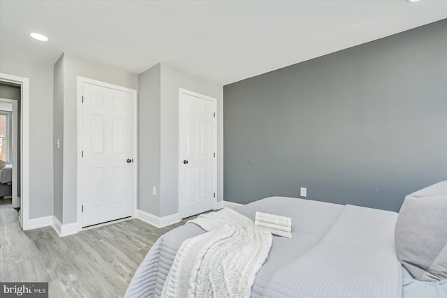 bedroom featuring a closet and light wood-type flooring