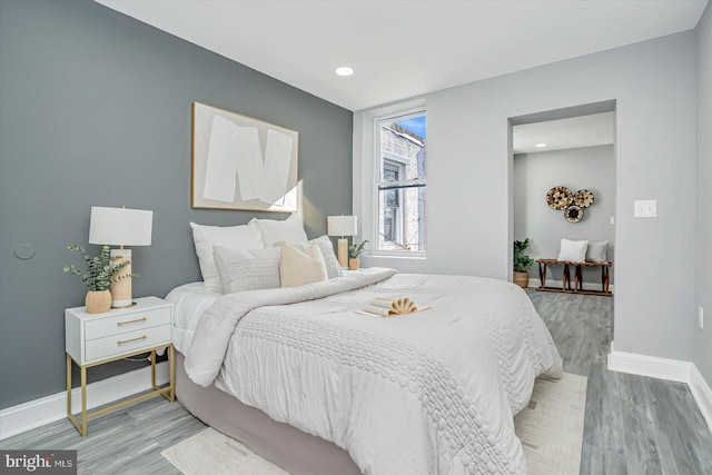 bedroom with light wood-type flooring